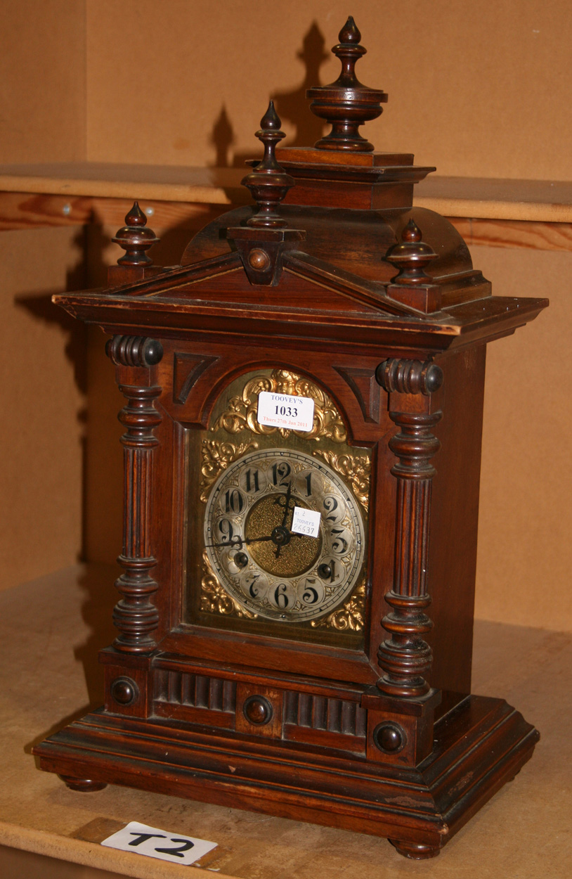 A Late 19th Century German Walnut Mantel Clock With Eight Day Movement Striking On A Gong The Archi