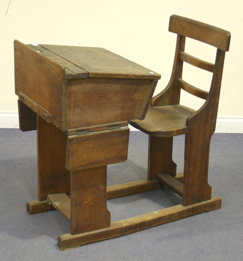 A late Victorian walnut and elm school desk with hinged writing slope ...