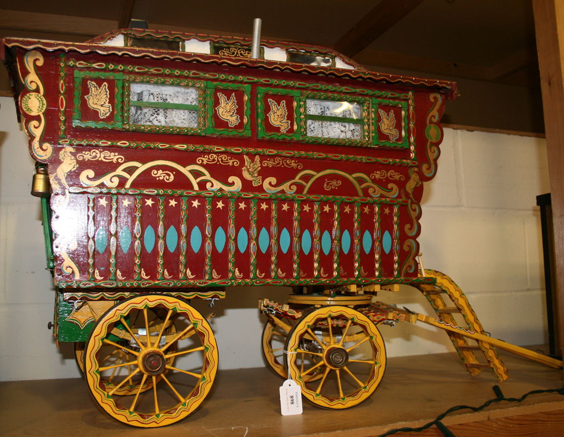 A Mid 20th Century Model Of A Gypsy Caravan With Overall Polychrome Painted Decoration And Metal Fit