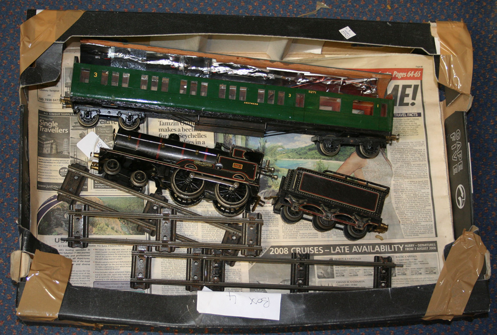 A gauge O clockwork 4-4-0 locomotive 2663 'George The Fifth' and tender ...