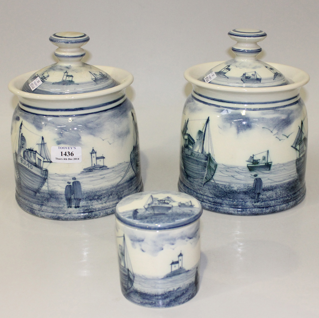 A pair of Rye Iden pottery storage jars and covers, decorated in