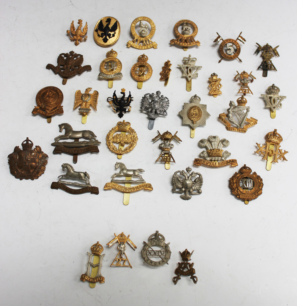A collection of cavalry badges, including Second World War 24th Lancers ...