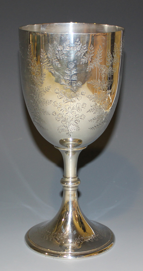 A Victorian silver goblet, the 'U' shaped body engraved with fern ...