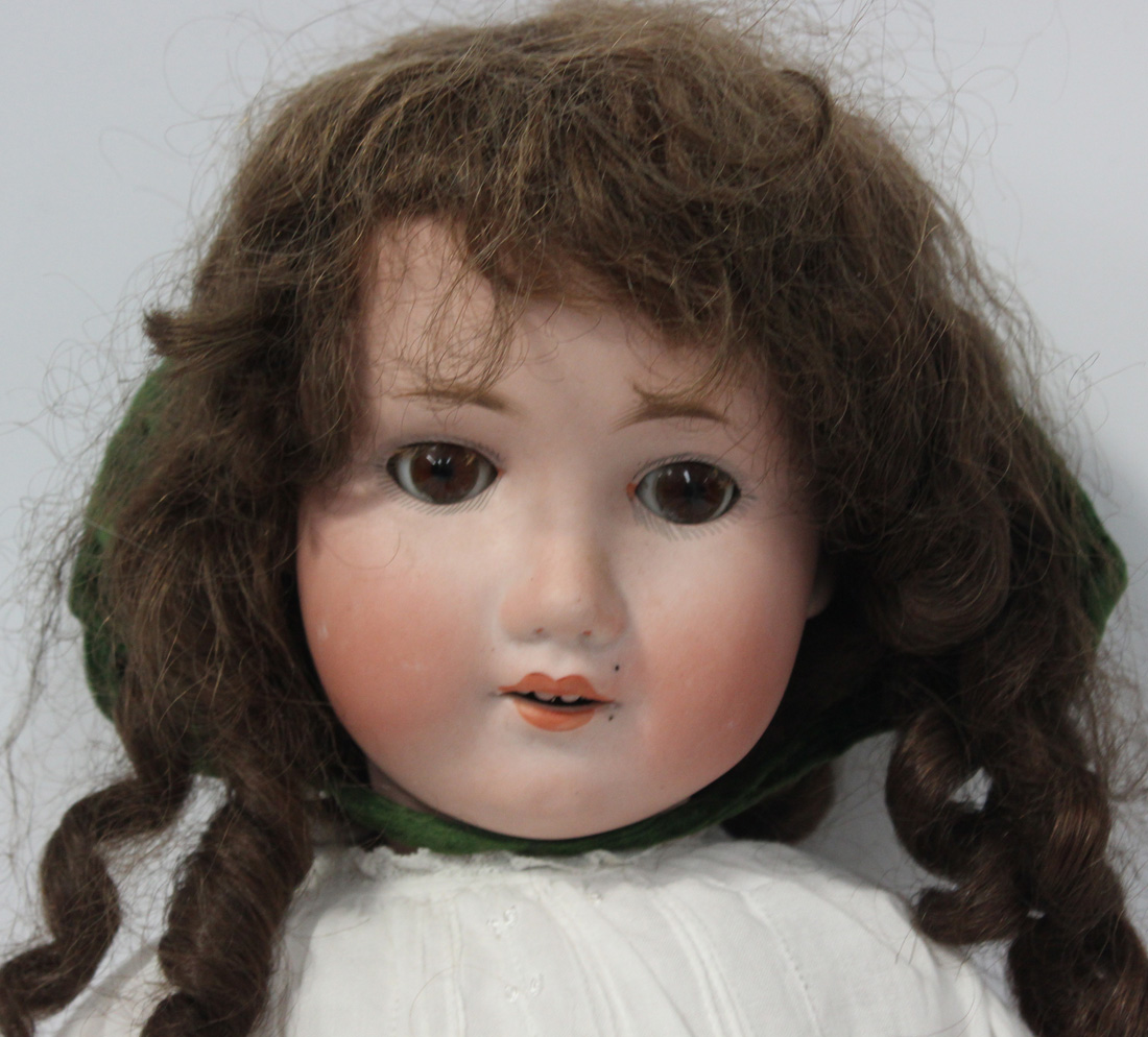A Max Oscar Arnold bisque head doll, impressed 'M.O.A. Welsch 200 