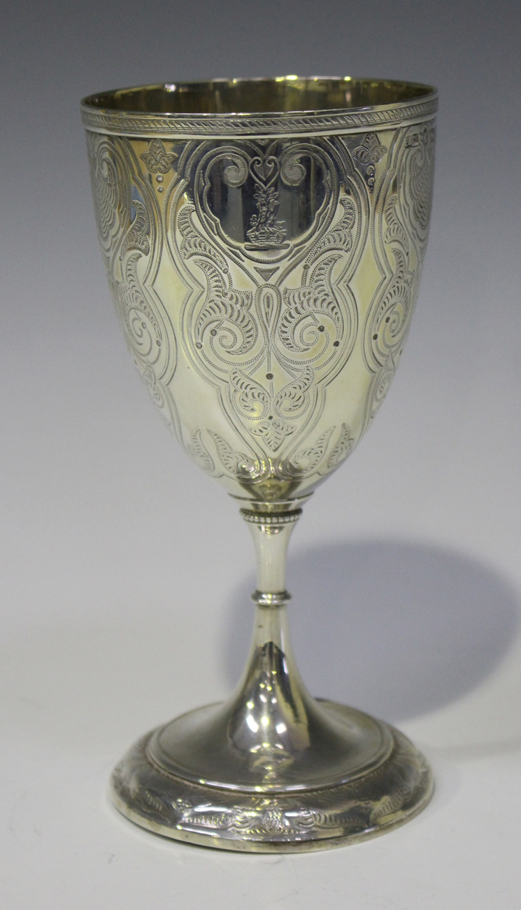 A Victorian silver goblet, the 'U' shaped body engraved with lappet ...