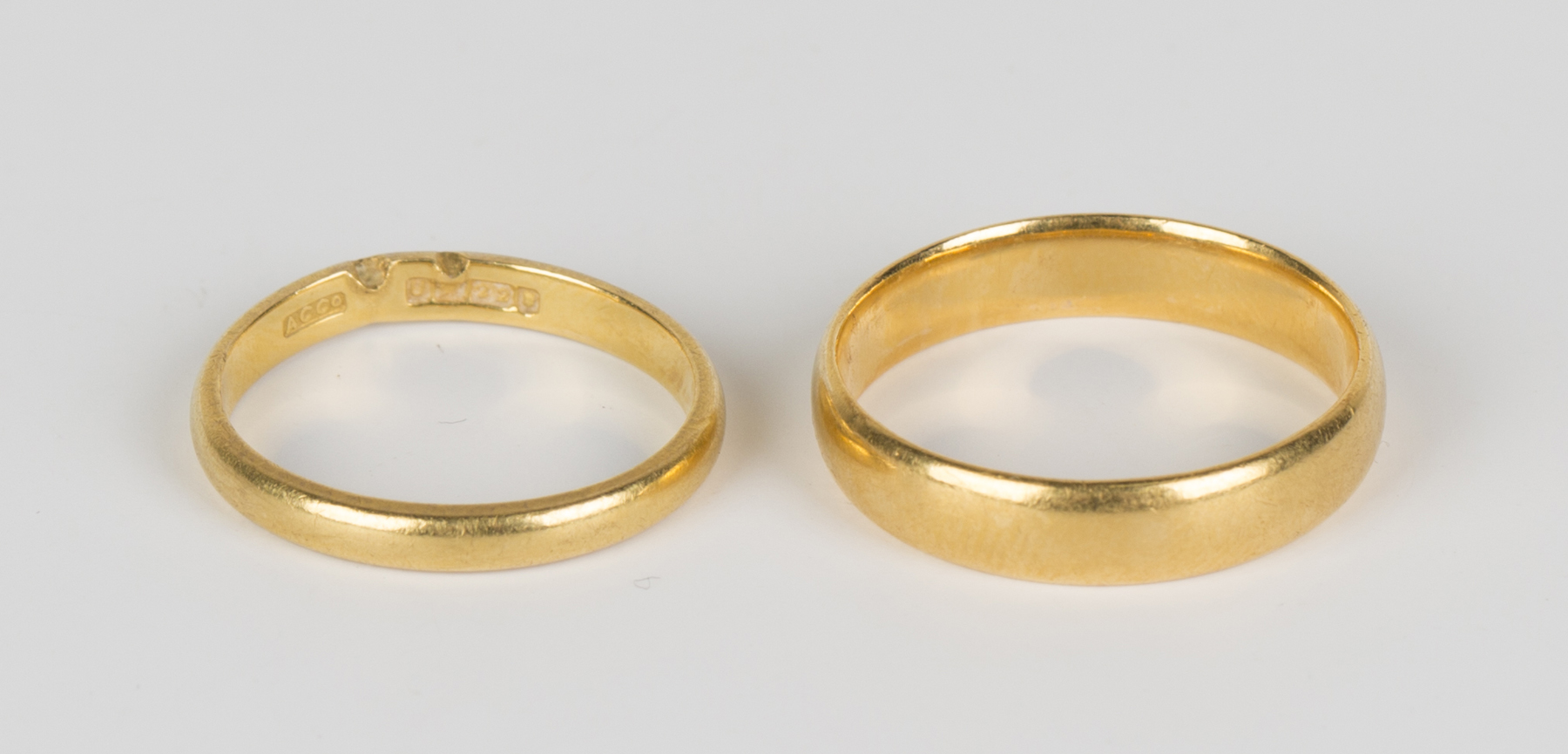 Two 22ct gold wedding rings, ring sizes approx M and Q.