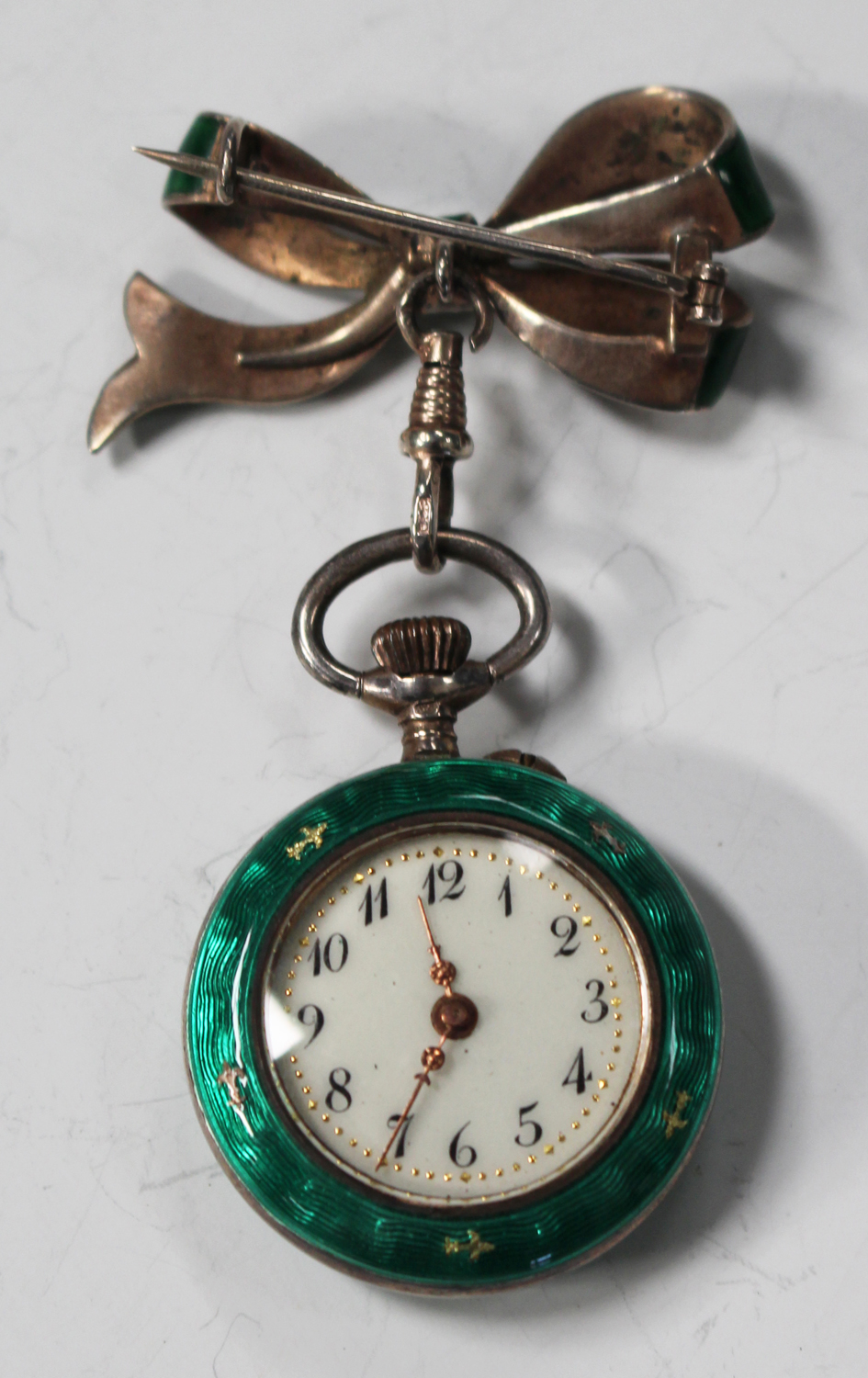 An enamelled silver keyless wind open-faced lady's fob watch, with an ...
