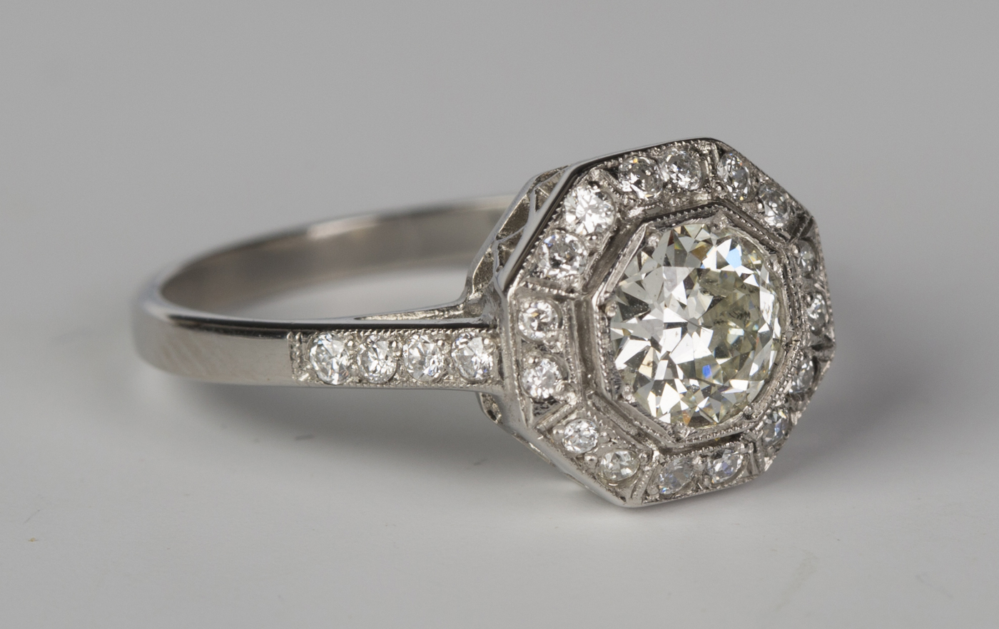 A platinum and diamond octagonal cluster ring, mounted with the ...