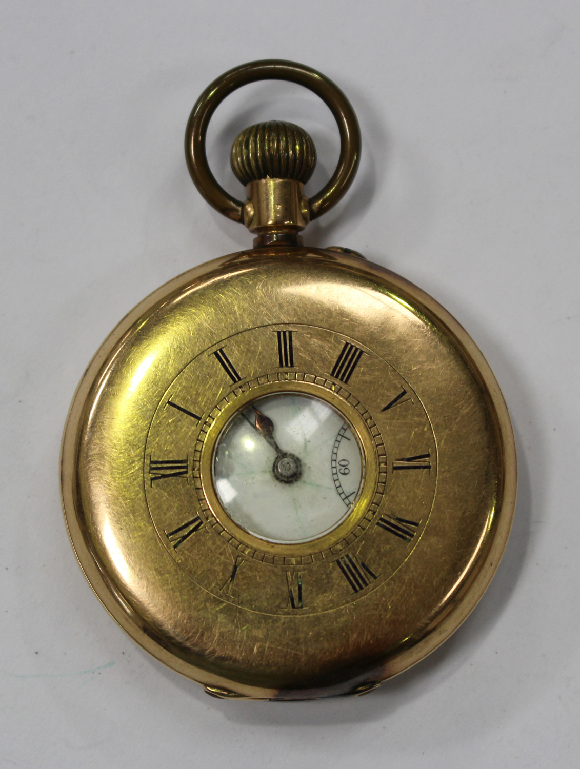 A gold half-hunting cased keyless wind gentleman's pocket watch with an ...