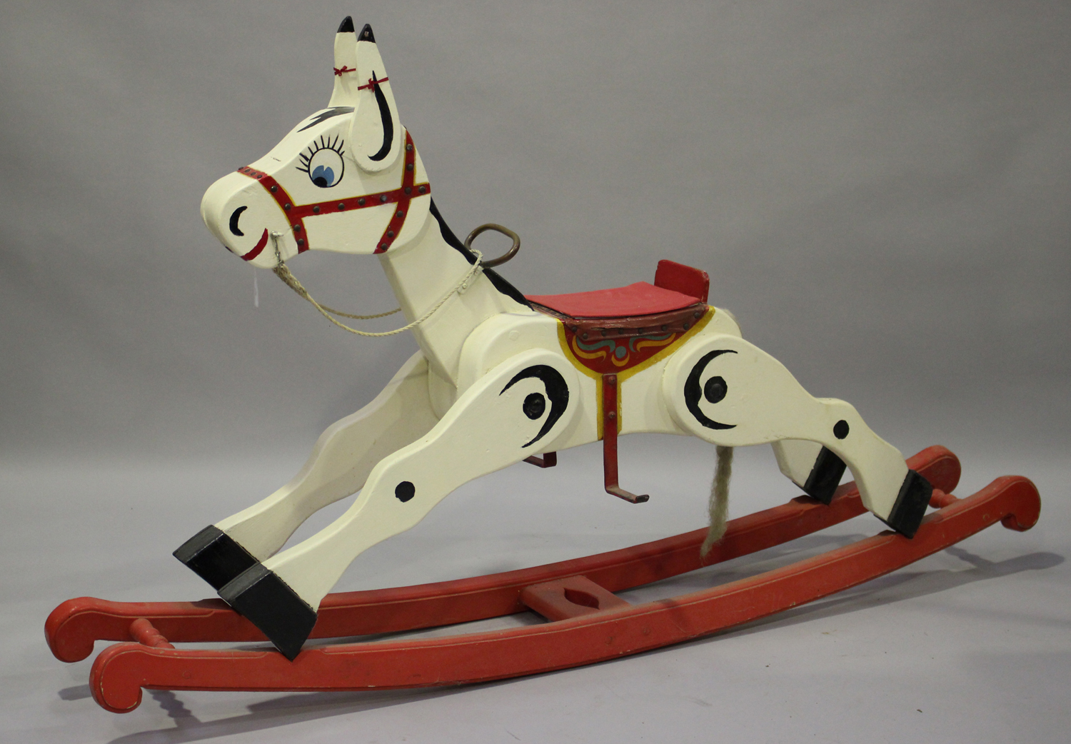 A painted wooden Muffin the Mule rocking horse with painted features ...