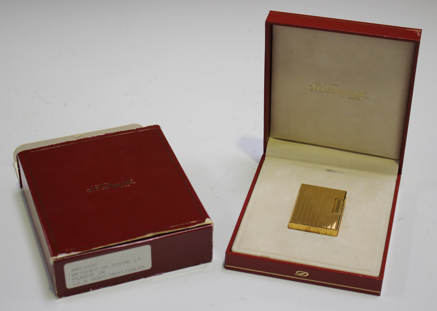 A Dupont Paris gold plated rectangular gas lighter with banded ...