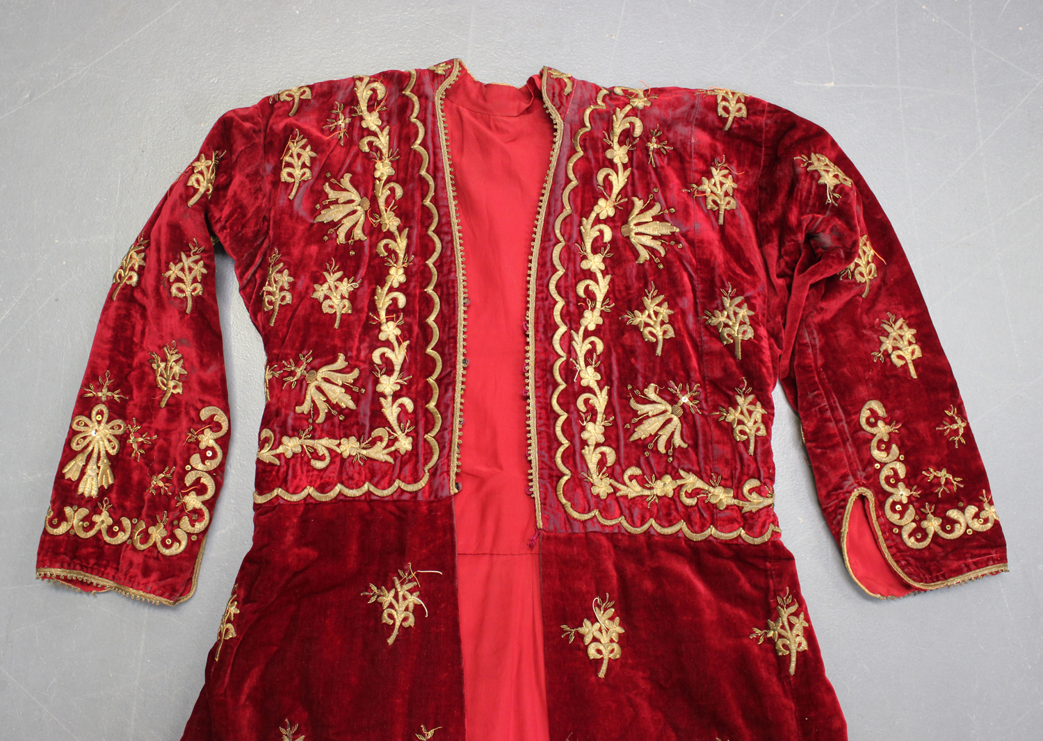 A 19th century Turkish claret velvet gentleman's gown with gilt metal ...