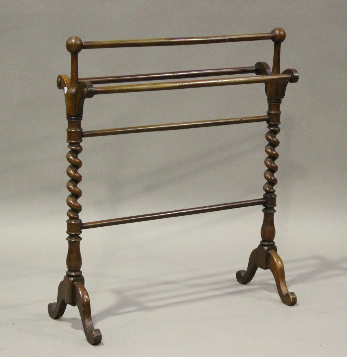 A late Victorian mahogany towel rail with barley twist supports, height ...