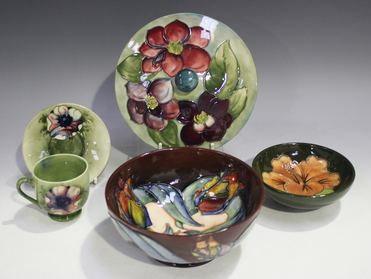 Five pieces of Moorcroft, comprising a Tulip bowl, diameter 16cm, a ...