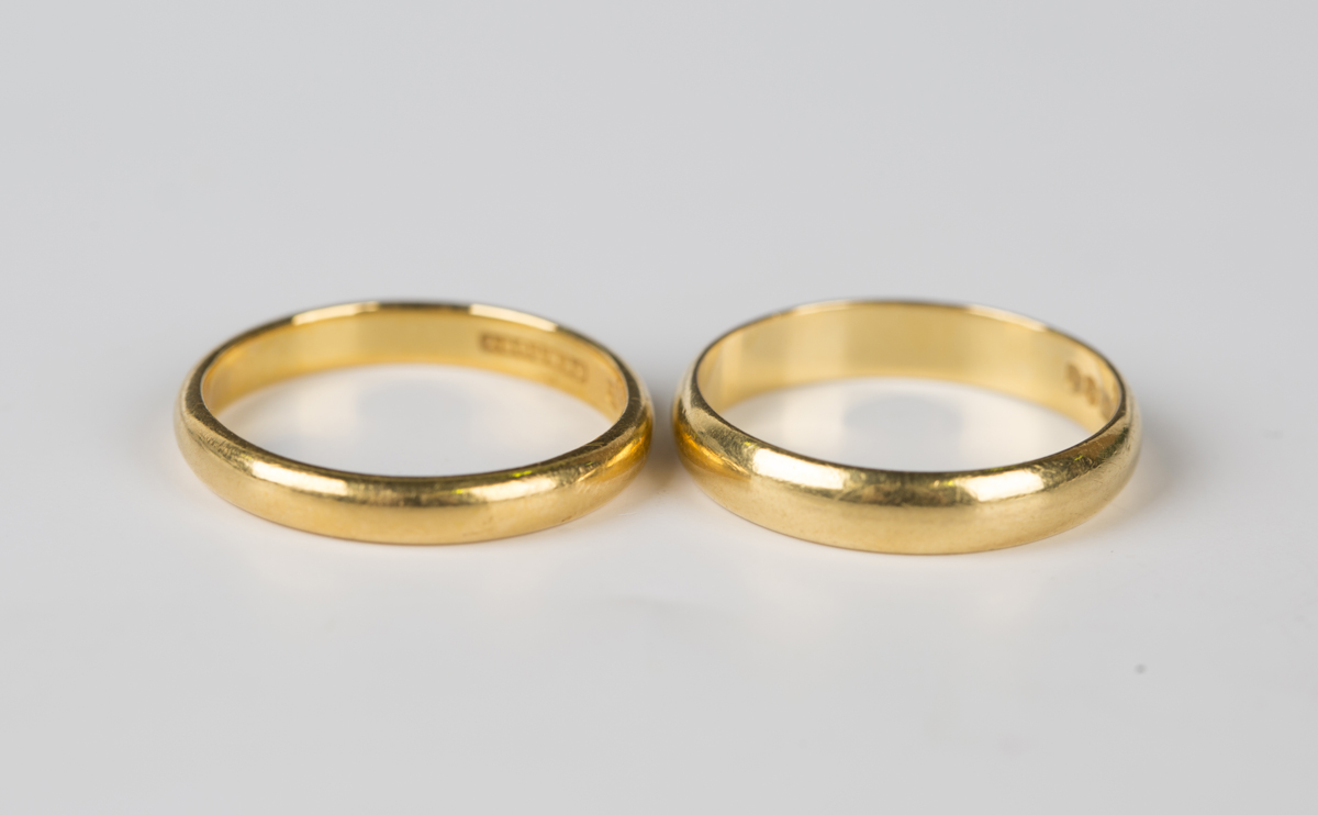 A 22ct gold wedding ring, Birmingham 1937, ring size approx P1/2, and ...