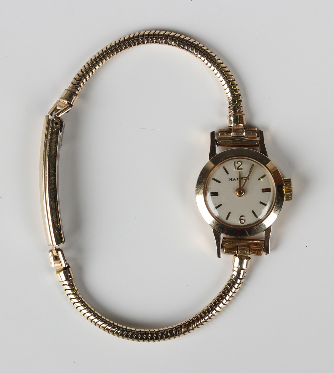 A Marvin gold cased lady's wristwatch, the signed silvered dial with ...