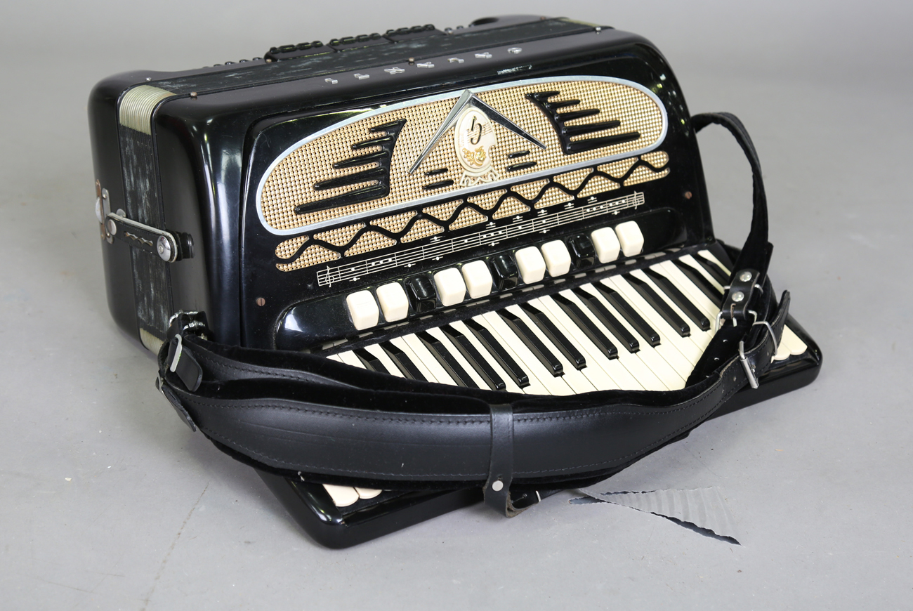 A late 20th century Bugari Armando piano accordion, serial number '427-80',  the black case