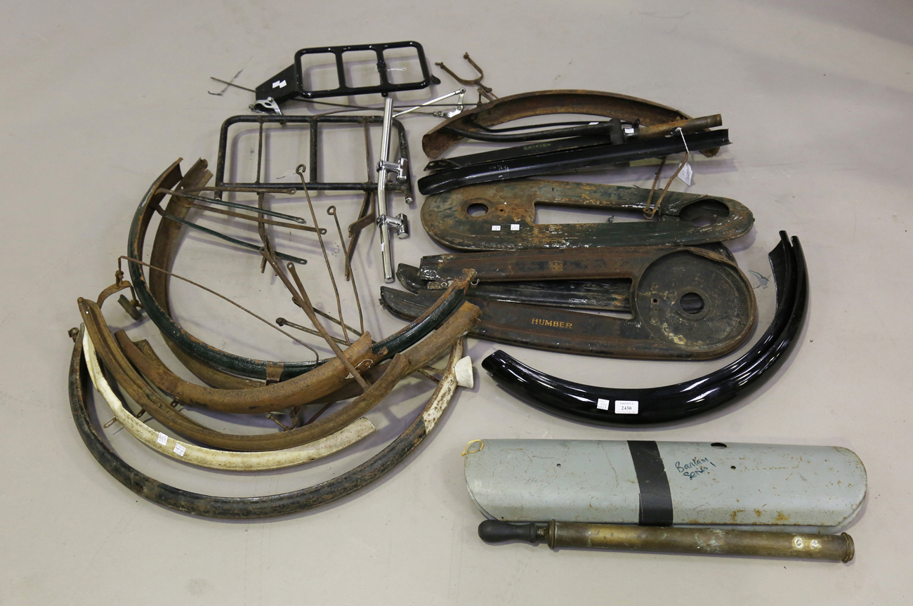 A collection of vintage bicycle parts, including mudguards, chain