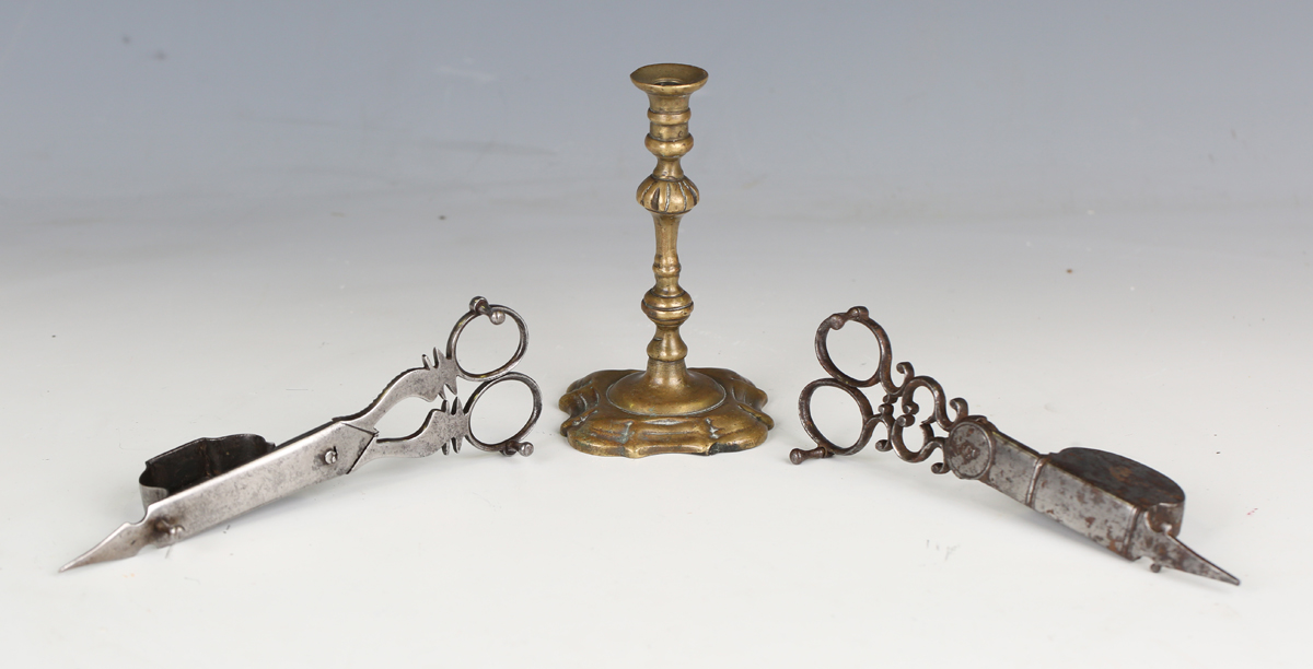 A pair of 18th century cut steel candle snuffers, stamped with crown