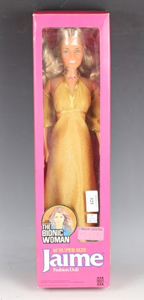 A Lady Penelope doll and a Bionic woman doll with small holdall of