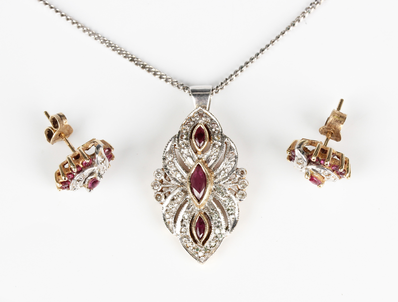 A 9ct gold, ruby and diamond pendant of foliate design, as converted ...