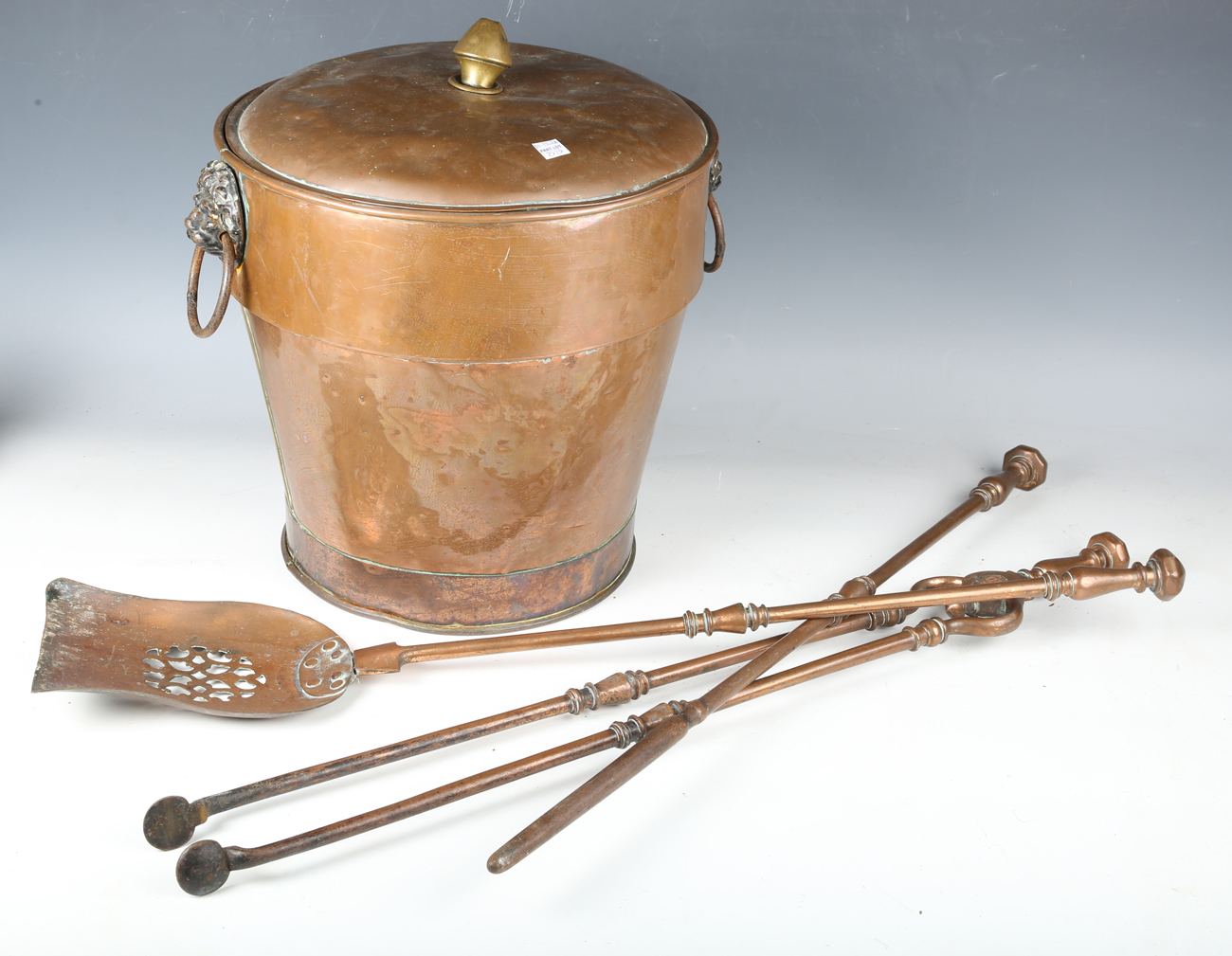 A set of three Victorian copper fire tools with pierced shovel and