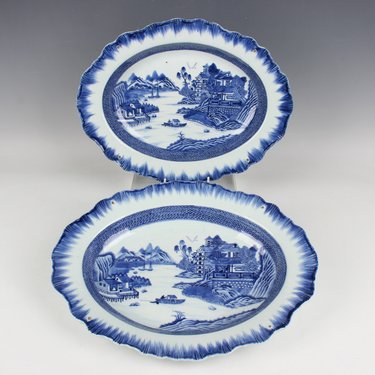 A pair of Chinese blue and white export porcelain oval meat dishes ...