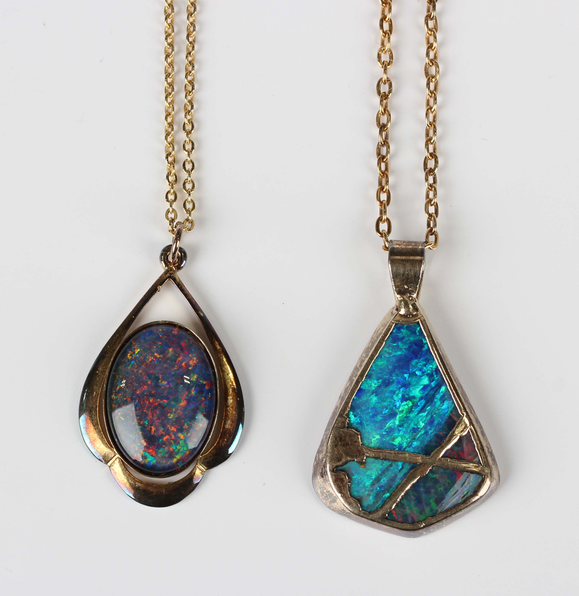 A silver gilt and opal pendant of abstract design, detailed 'STG SIL ...