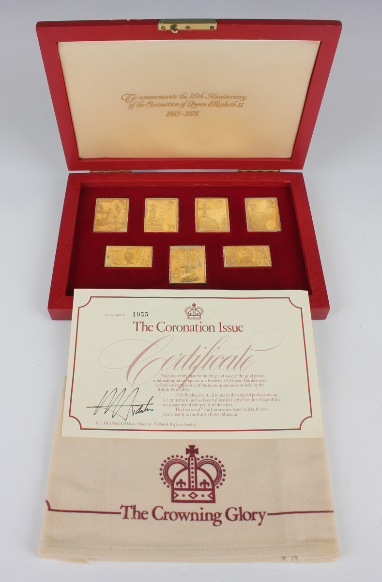 A set of seven gold plated silver replica stamps commemorating the