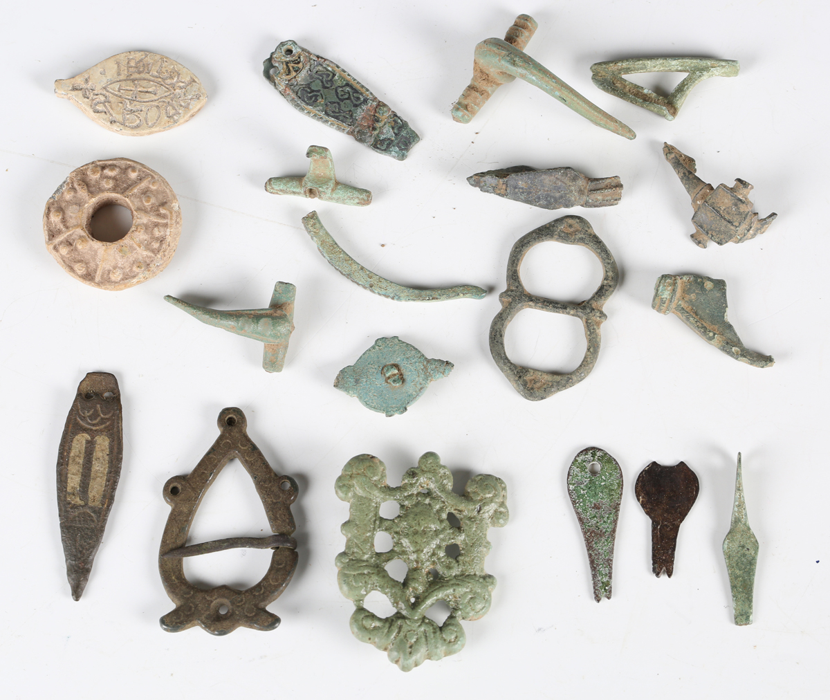 A collection of British metal detecting finds, including an oval vesica ...