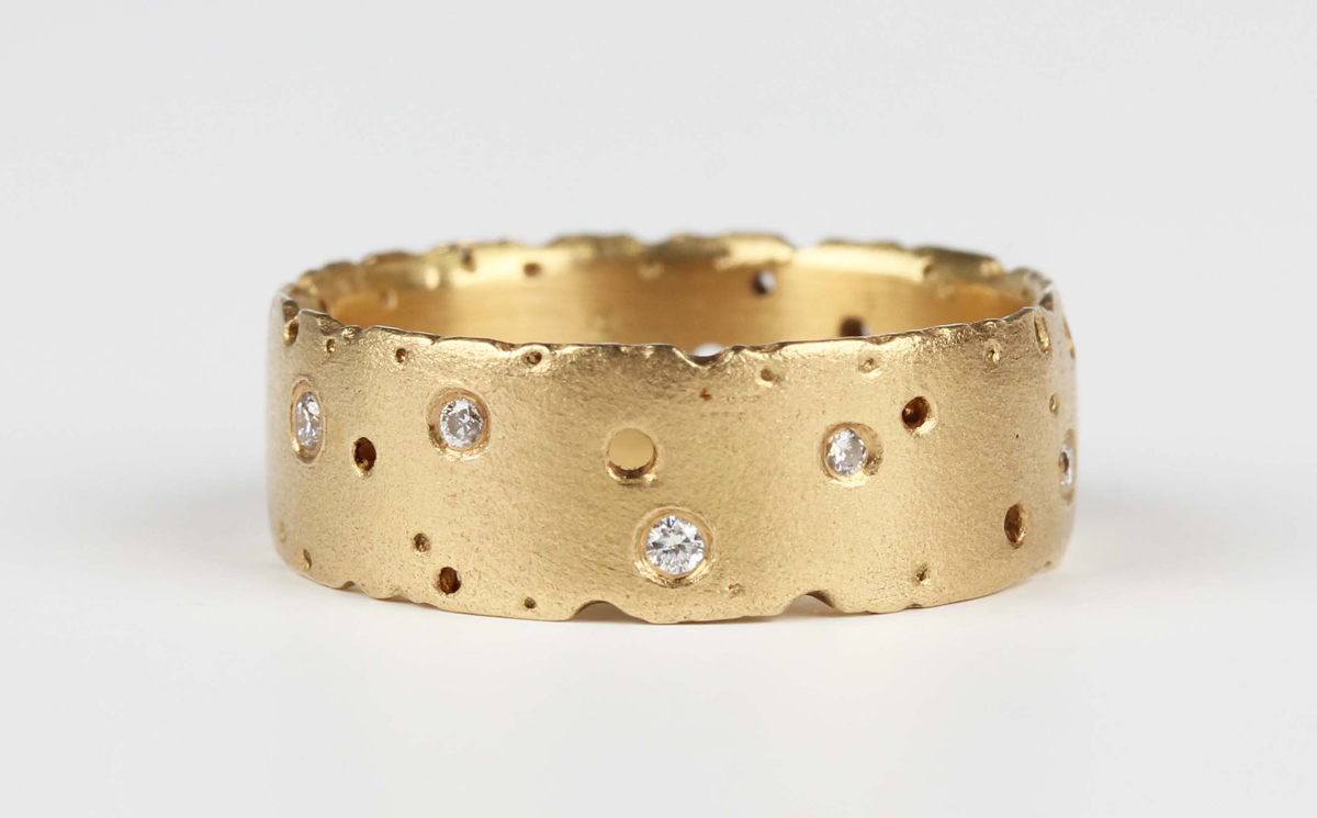 A Kate Smith 18ct gold and diamond eternity ring in a rustic design ...